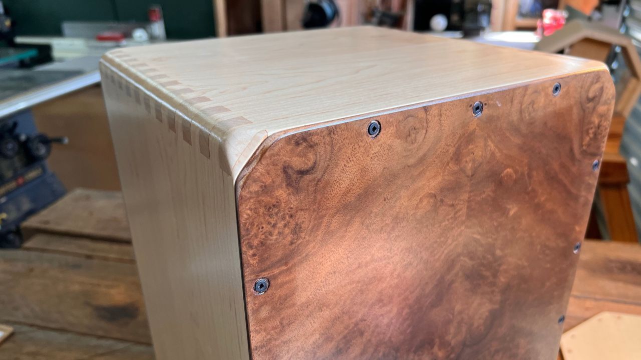 Hero image for the blog post “Best Cajons for 2025.” Shows a handcrafted Kopf Cajon built with solid walnut and maple tonewoods in the Kopf Percussion Studio.