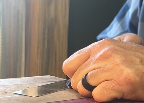 This photo shows a spline joint for a cajon being cut by hand.