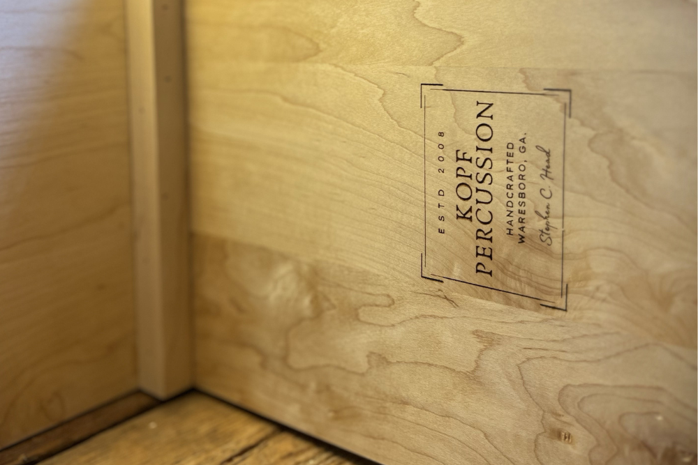Top-down view of an unfinished handcrafted cajón shell, showing clean joinery and internal construction details that affect acoustic performance.