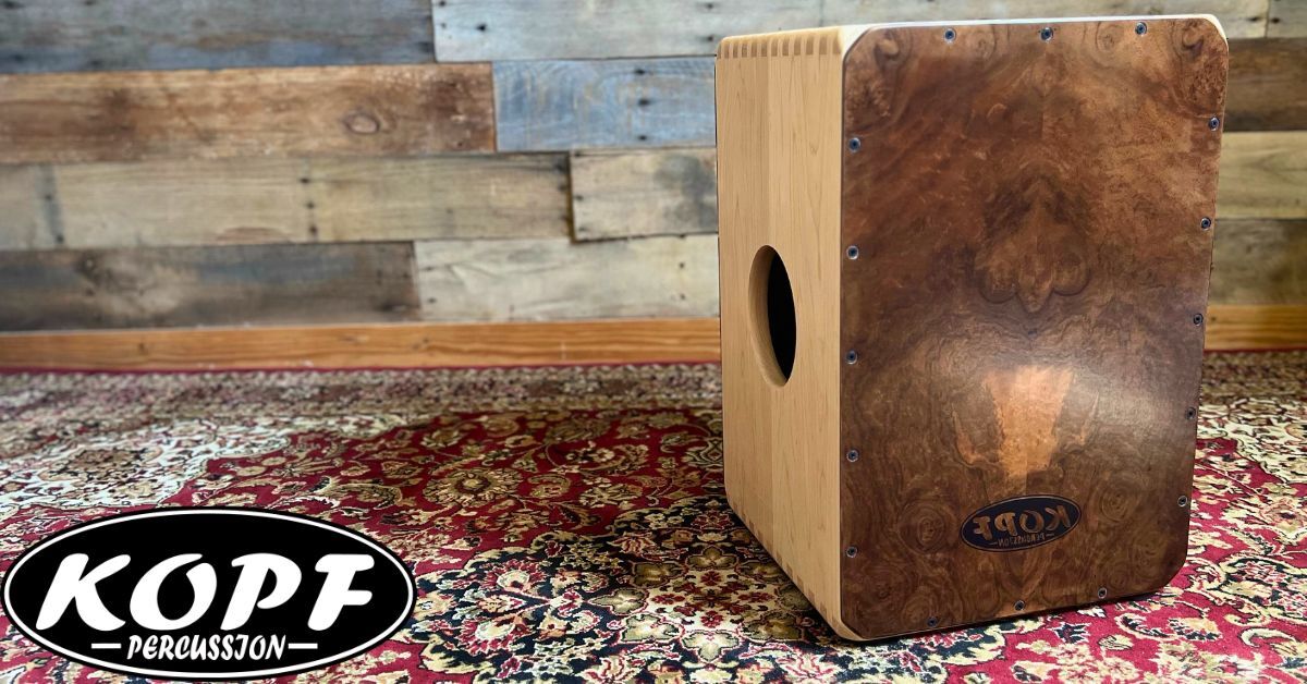 Handcrafted maple cajon featuring a walnut burl faceplate, built by Kopf Percussion with a focus on material selection, structural integrity, and musical response.